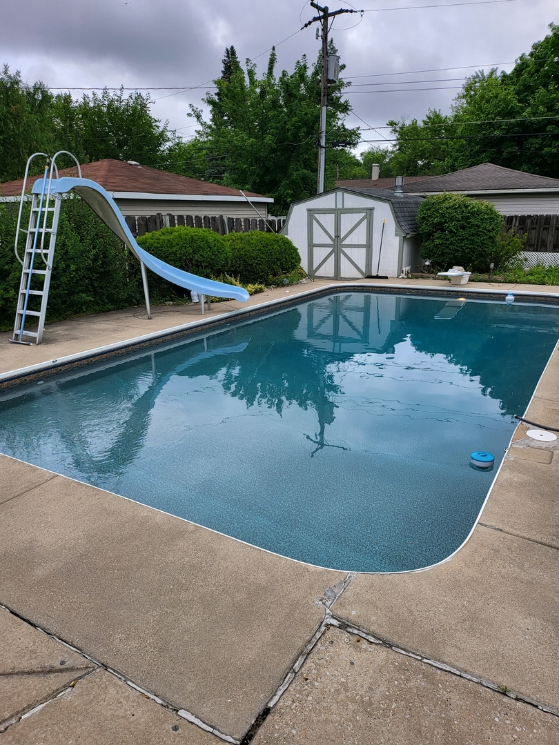 3034 190th Street Lansing, IL 60438 - Photo 21 of 25 a view of swimming pool with a yard