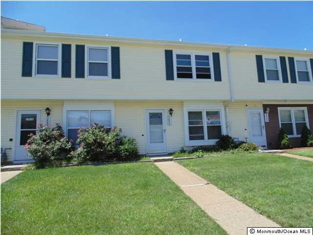 2006 Sawmill Road Brick, NJ 08724 - Photo 1 of 6 front view of a brick house with a yard