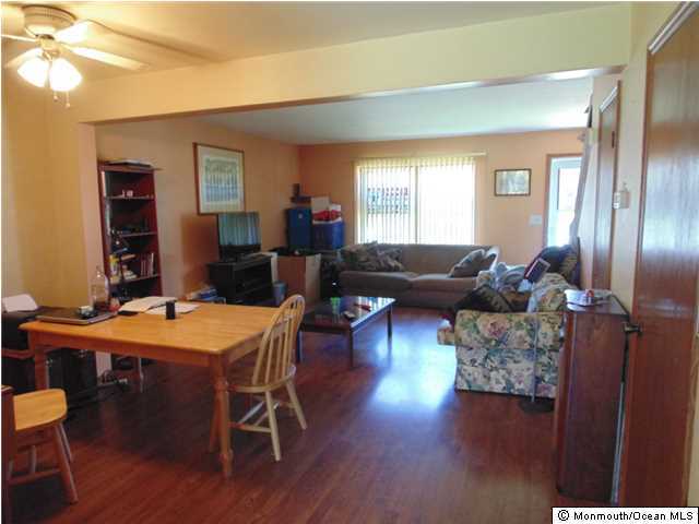 2006 Sawmill Road Brick, NJ 08724 - Photo 5 of 6 a living room with furniture a wooden floor and a window