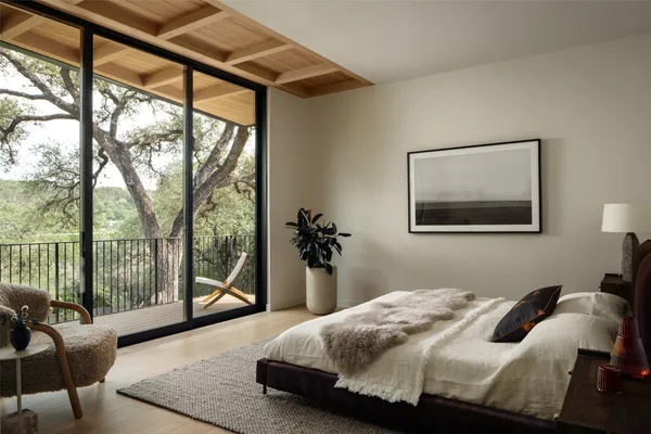 a bedroom with a bed and cabinets