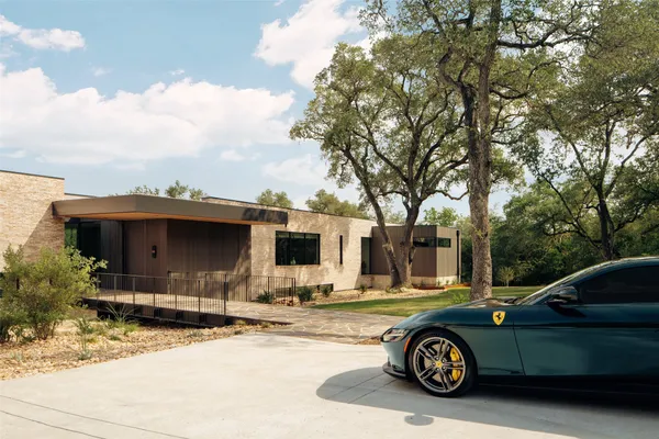 a view of house with backyard and deck