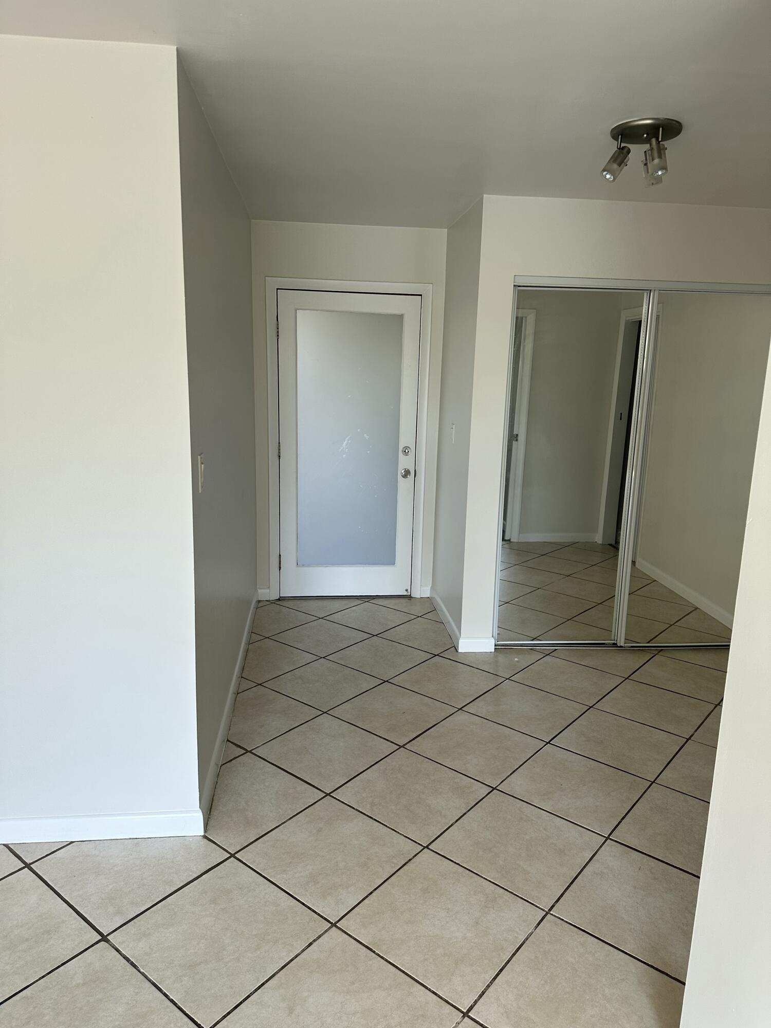 1480 East Sample Road, Unit 207 Pompano Beach, FL 33064 - Photo 11 of 14 a view of a room with mirror