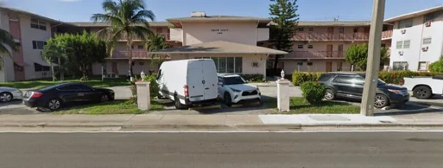 a view of a car parked in front of a building