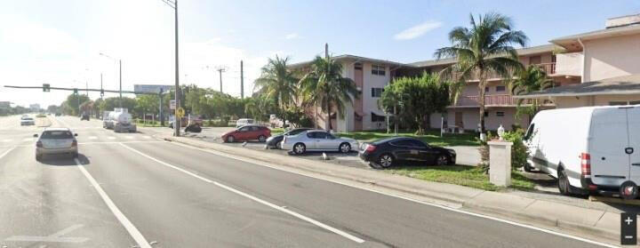 1480 East Sample Road, Unit 207 Pompano Beach, FL 33064 - Photo 14 of 14 a view of street with cars