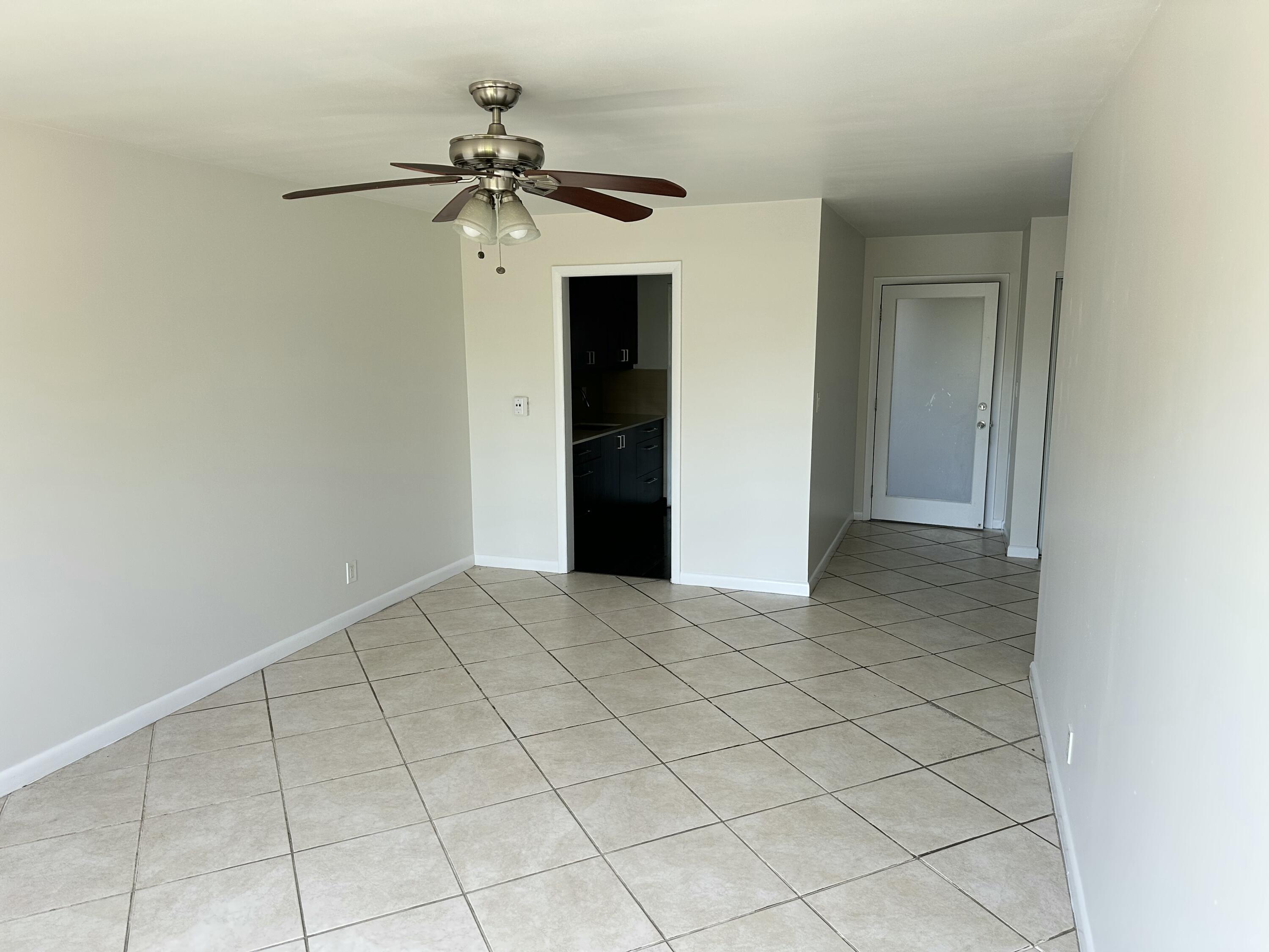 1480 East Sample Road, Unit 207 Pompano Beach, FL 33064 - Photo 5 of 14 a view of an empty room