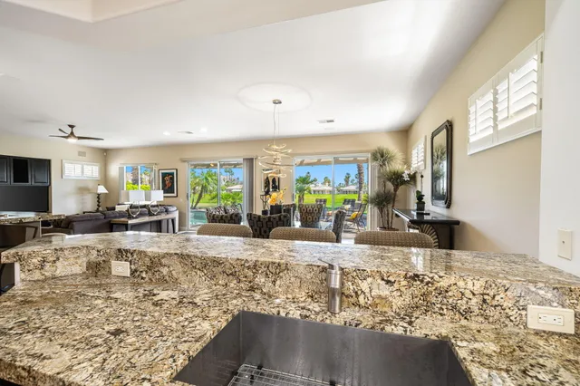 a view of a living room and kitchen