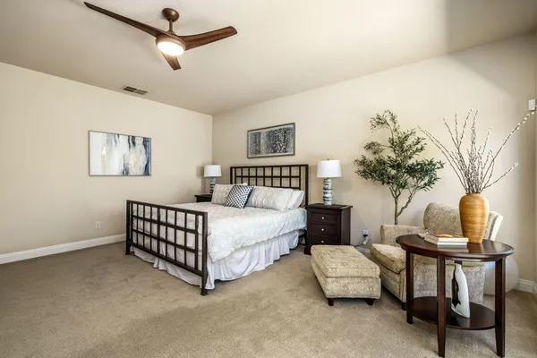 a bedroom with furniture and a bed