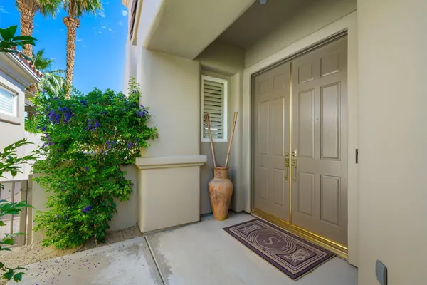 a view of an entryway with garden