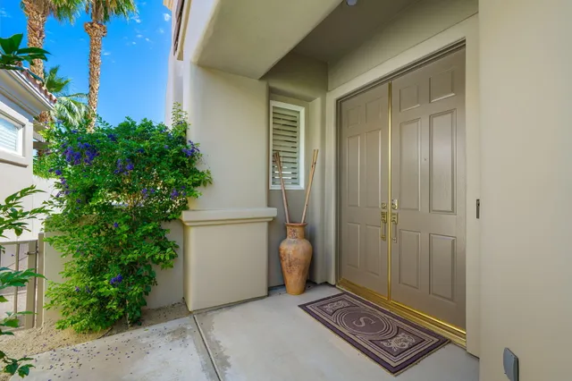 a view of an entryway with garden