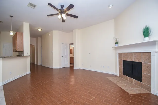 a view of an empty room with a fireplace