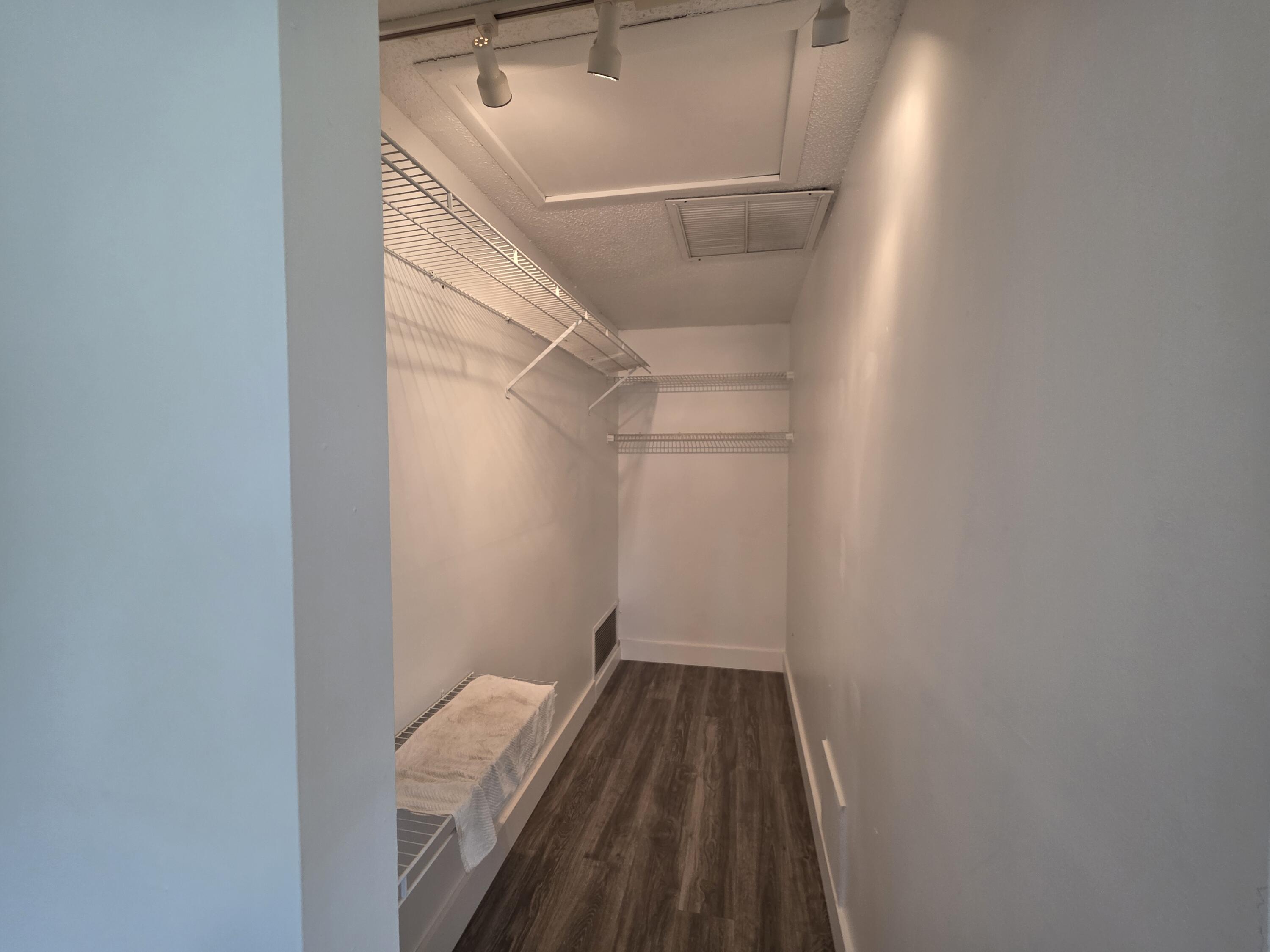 718 Whippoorwill Lane Delray Beach, FL 33445 - Photo 17 of 38 a view of a hallway