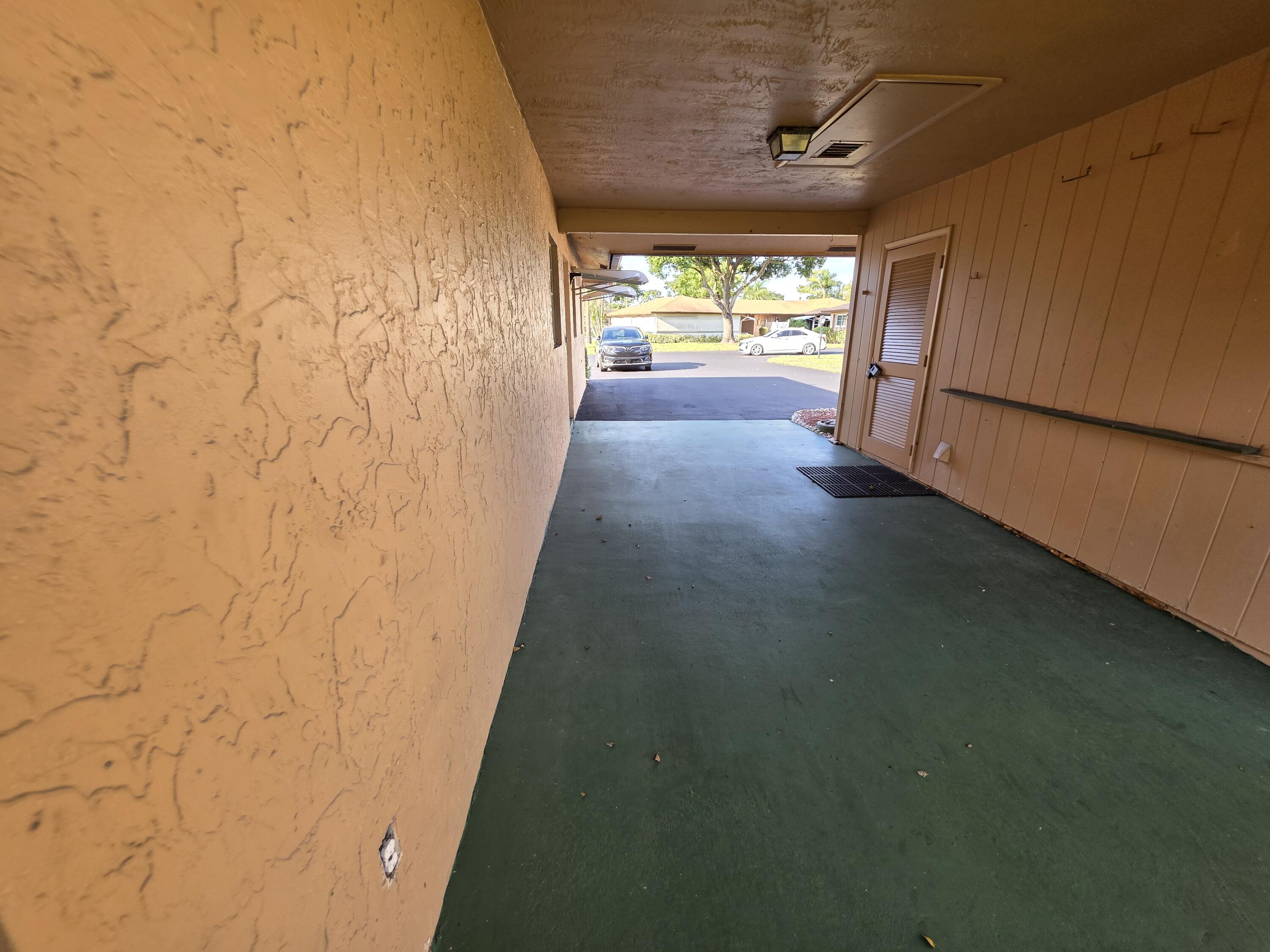 718 Whippoorwill Lane Delray Beach, FL 33445 - Photo 30 of 38 a view of an empty room and a window
