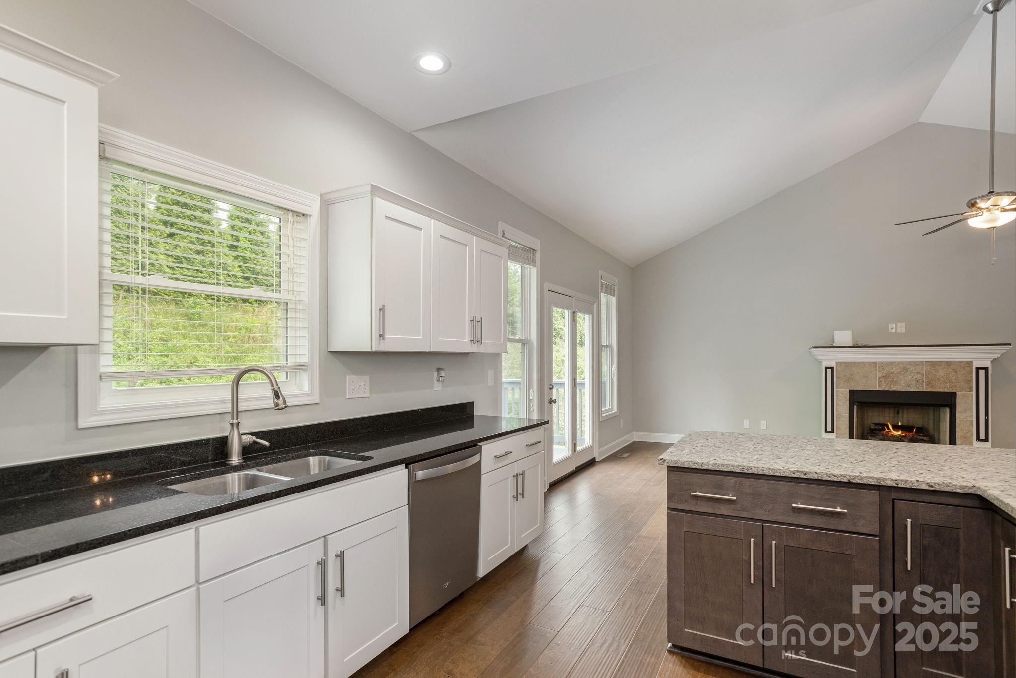 76 Tryon View Drive Flat Rock, NC 28731 - Photo 15 of 30 a kitchen with granite countertop a sink and a stove