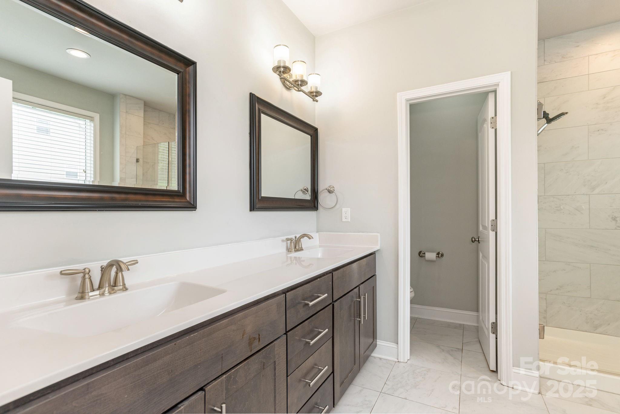 76 Tryon View Drive Flat Rock, NC 28731 - Photo 19 of 30 a bathroom with a sink and a mirror