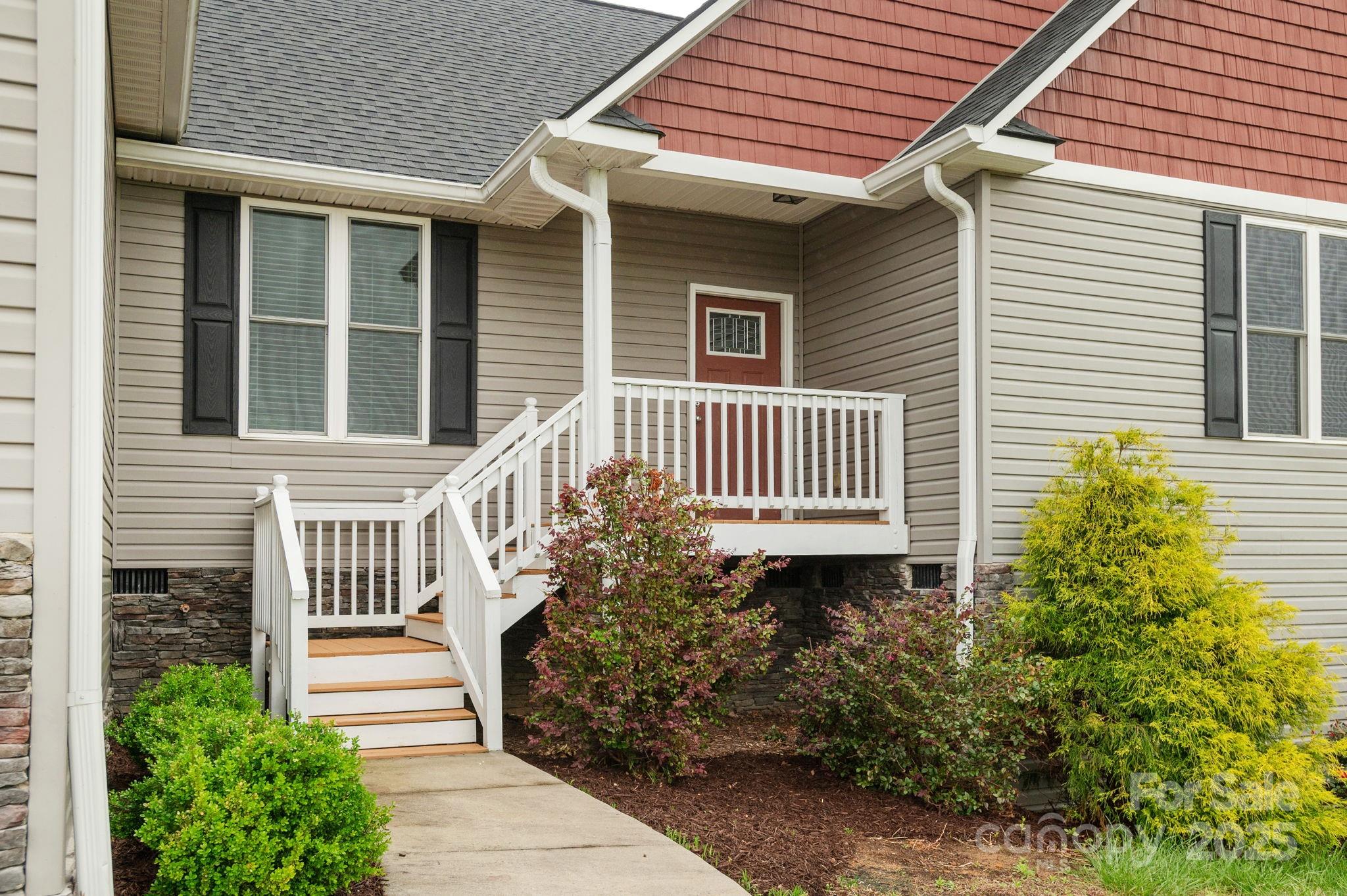 76 Tryon View Drive Flat Rock, NC 28731 - Photo 2 of 30 a front view of a house with a garden