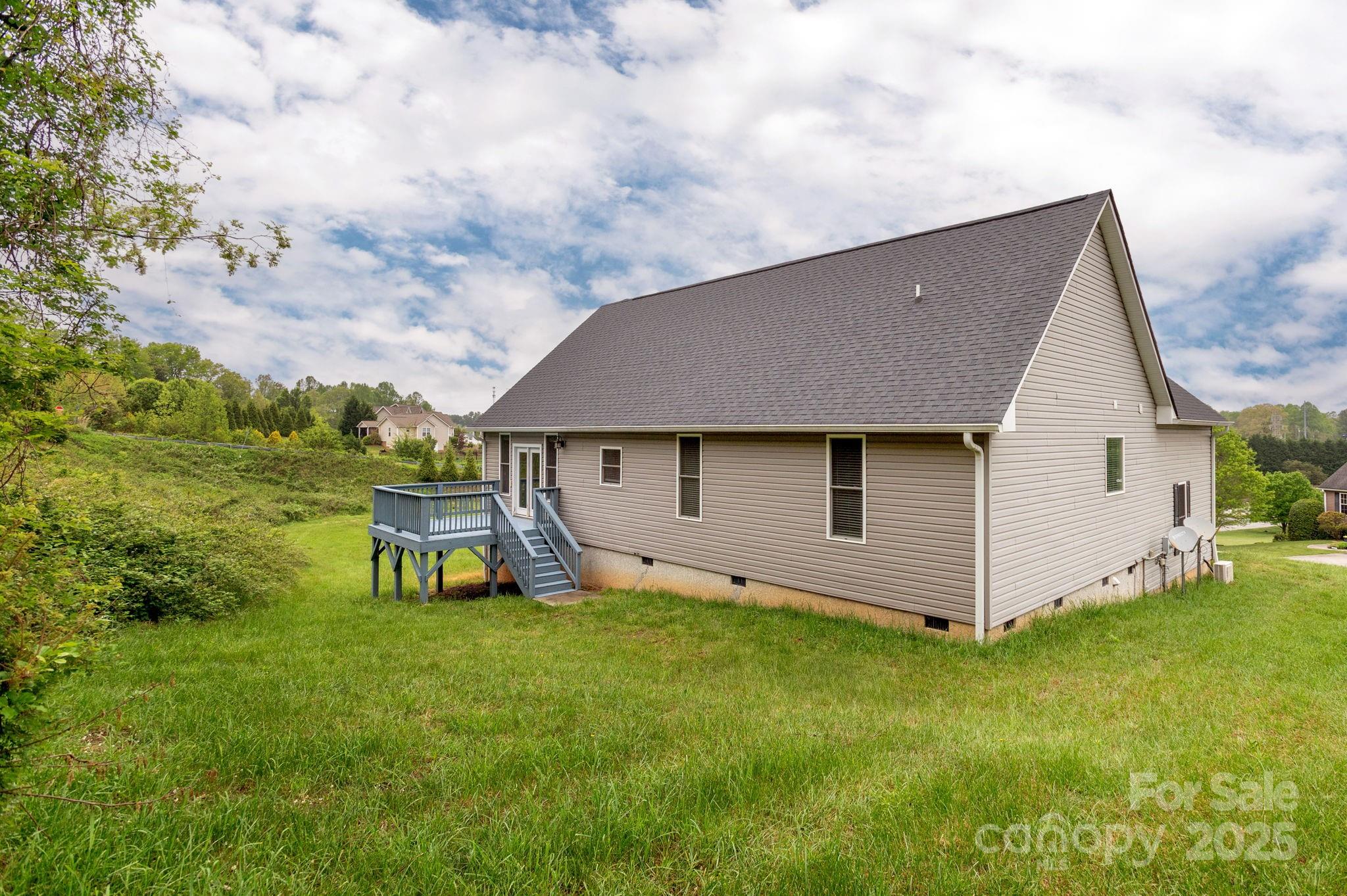 76 Tryon View Drive Flat Rock, NC 28731 - Photo 30 of 30 a view of a house with a yard