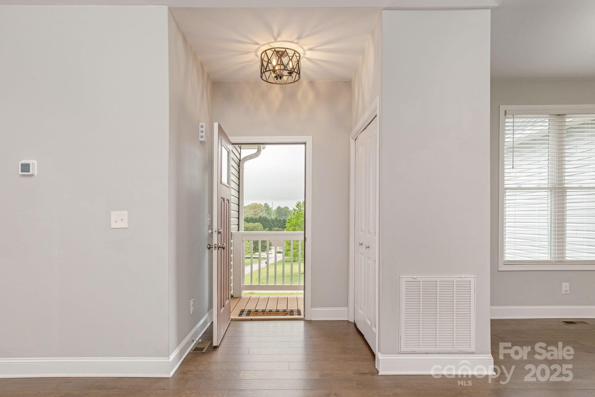 76 Tryon View Drive Flat Rock, NC 28731 - Photo 3 of 30 a view of an entryway with wooden floor