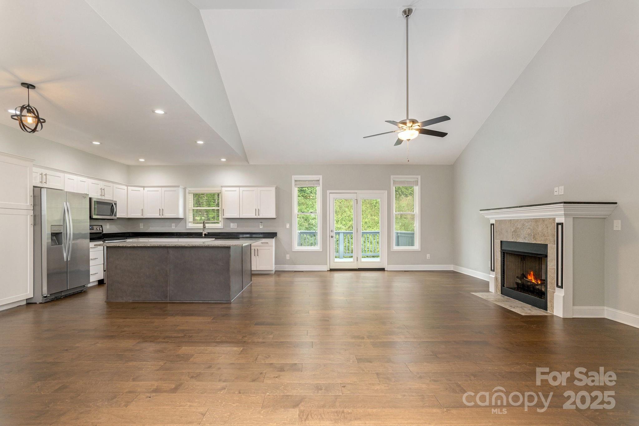 76 Tryon View Drive Flat Rock, NC 28731 - Photo 6 of 30 a view of kitchen with stainless steel appliances granite countertop a stove top oven a sink a counter space and cabinets