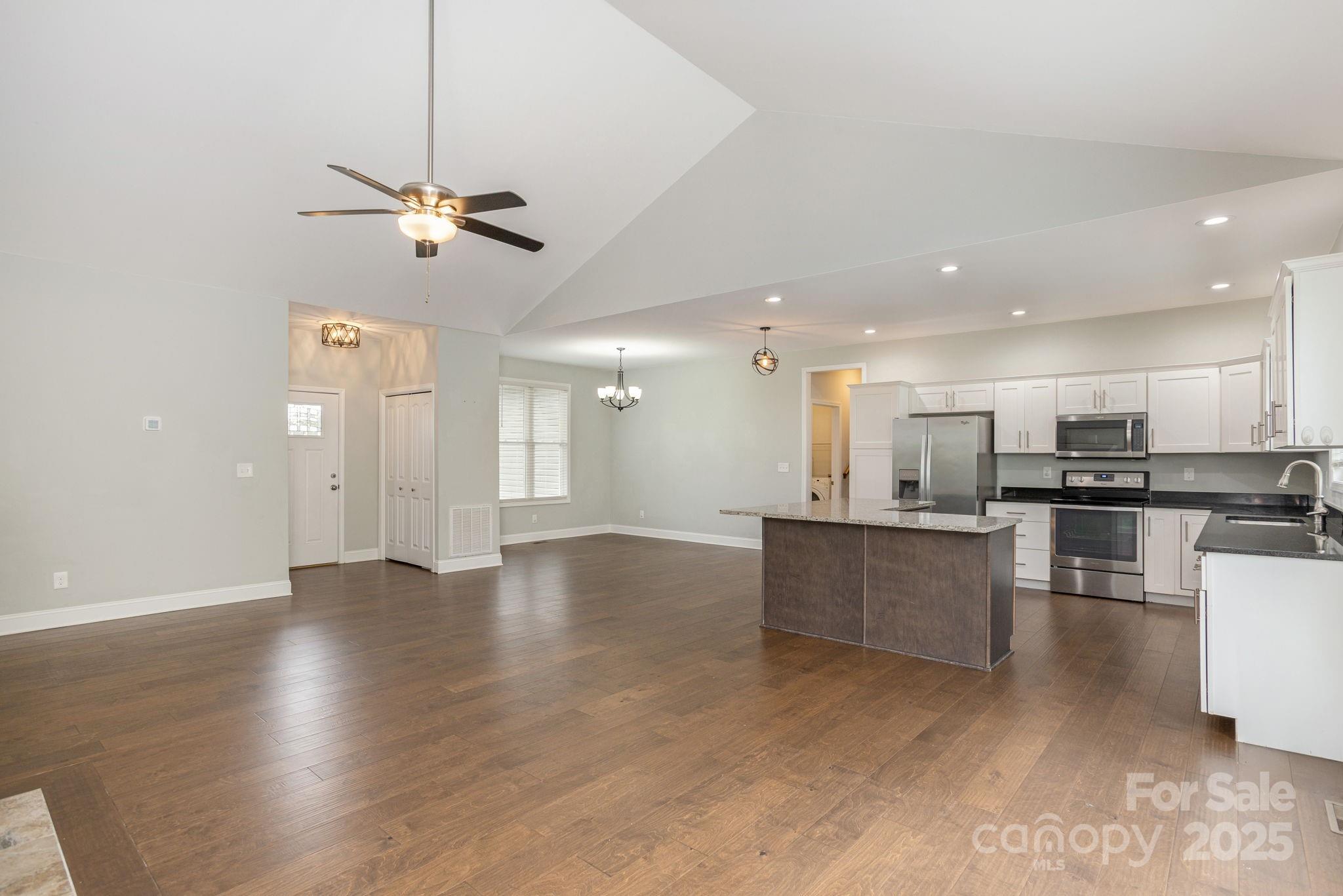 76 Tryon View Drive Flat Rock, NC 28731 - Photo 8 of 30 a view of kitchen with stainless steel appliances refrigerator stove microwave and cabinets