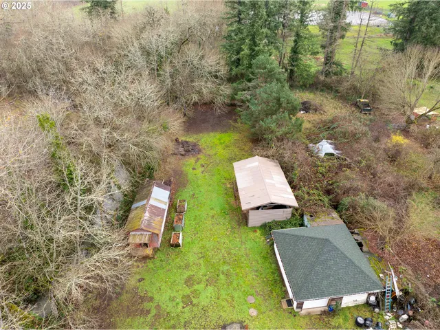 a aerial view of a house with a yard basket ball court and outdoor seating