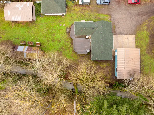 an aerial view of residential house with pool