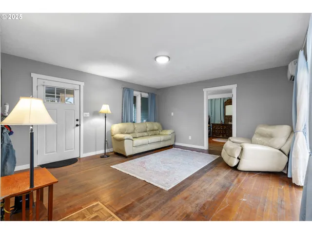 a bedroom with a large bed and a couch