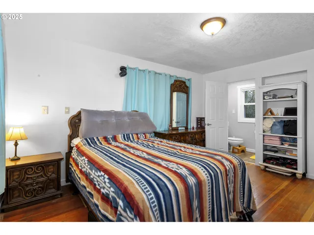 a bedroom with a bed and a cabinets