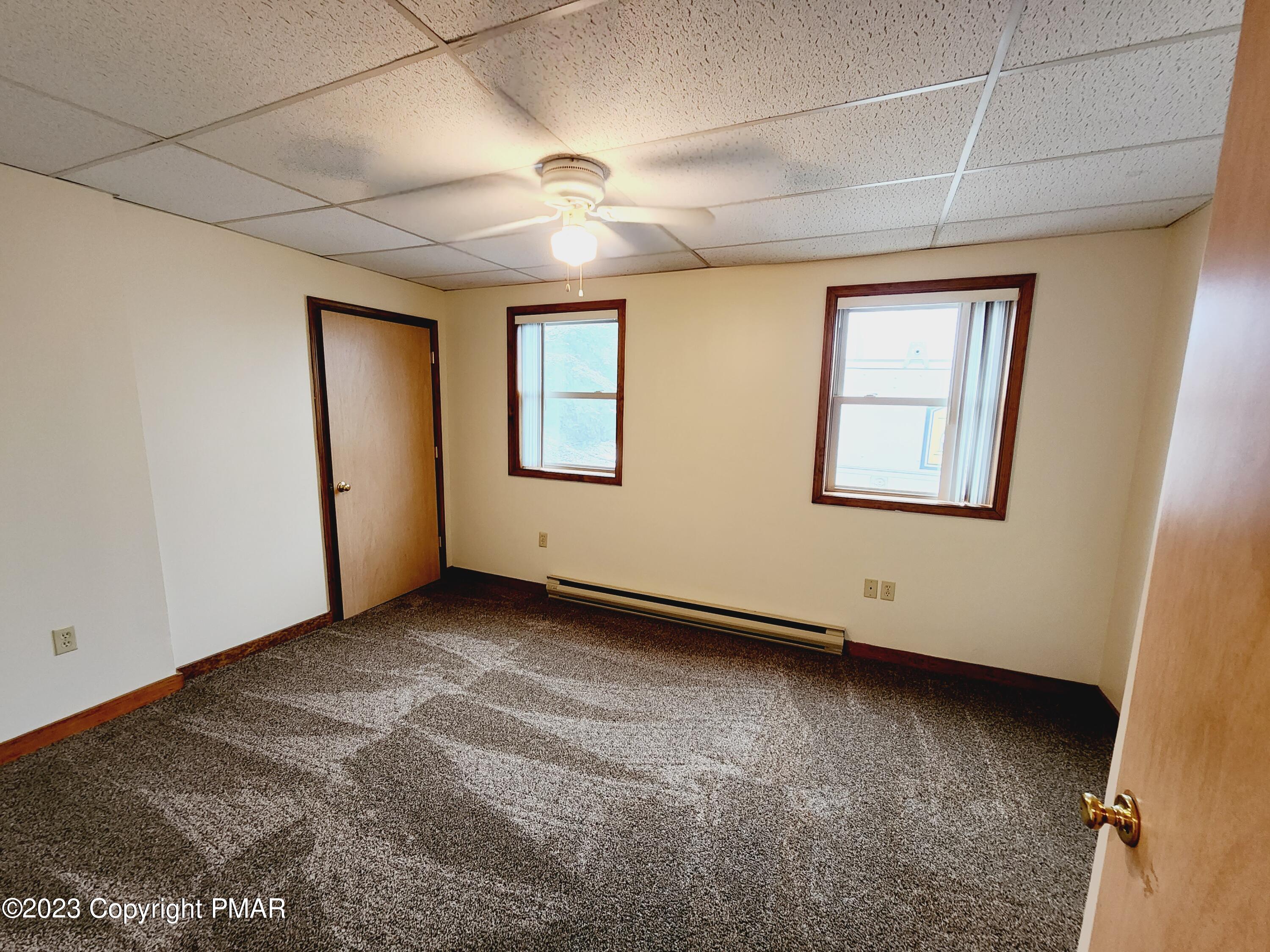 216 Friemann Lane Sciota, PA 18354 - Photo 6 of 7 an empty room with windows