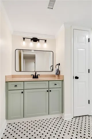 a bathroom with a sink a vanity and a mirror
