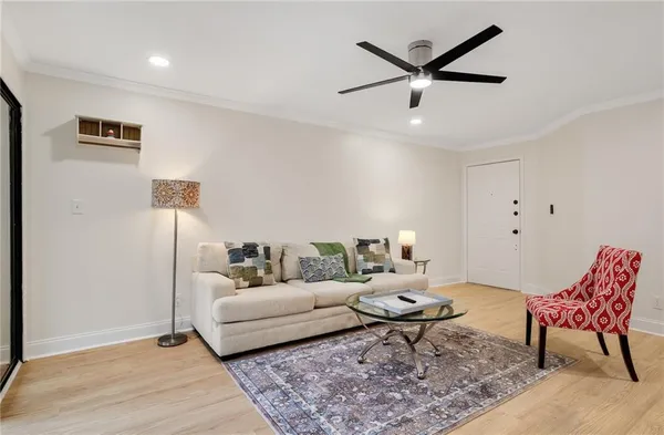 a living room with furniture and a rug
