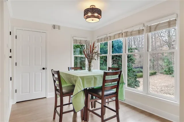 a view of a dining room with furniture window and outside view