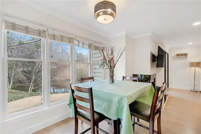 a view of a dining room with furniture window and wooden floor