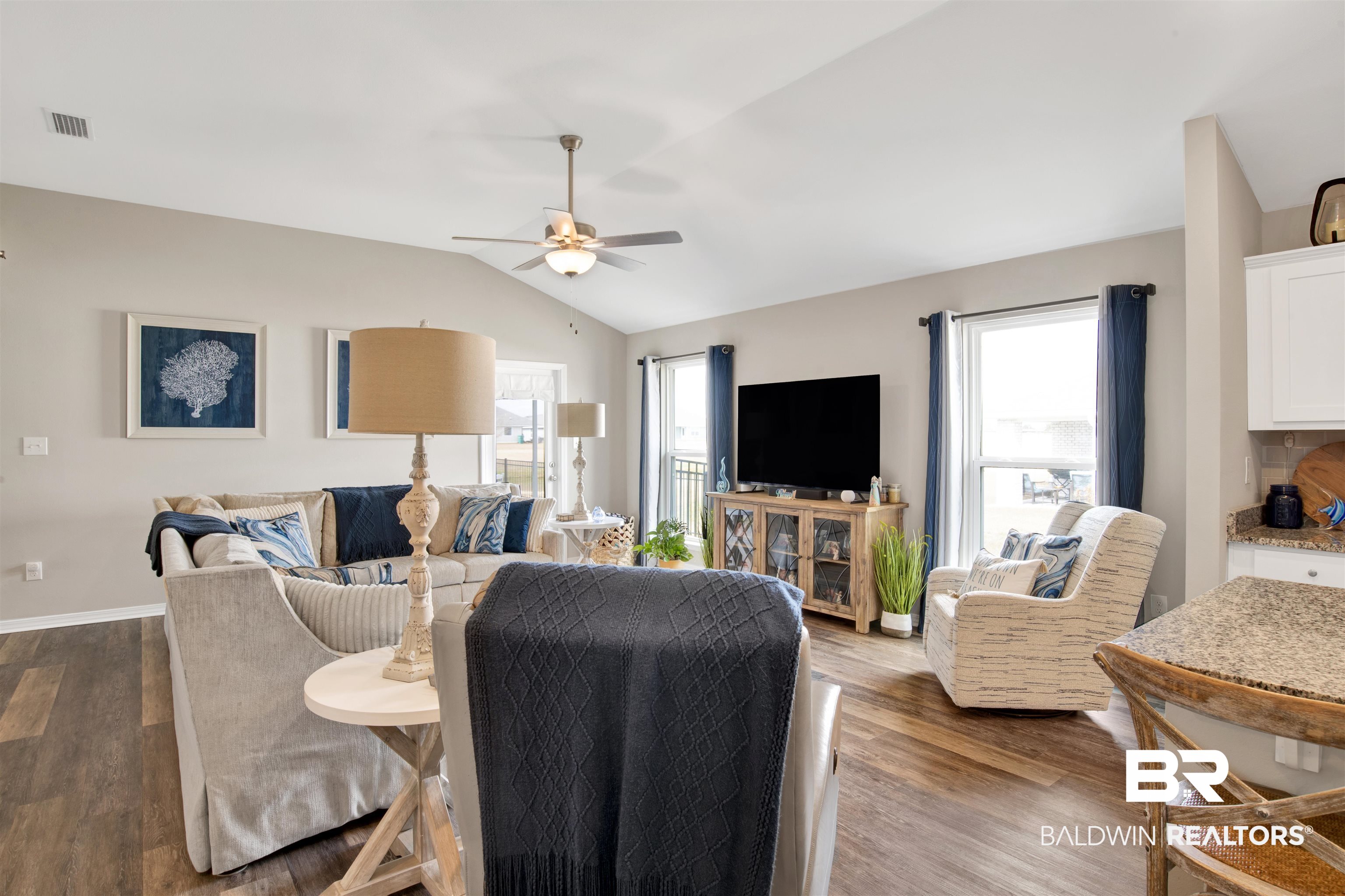 3097 Ingrid Lane Foley, AL 36535 - Photo 10 of 38 Living room with vaulted ceiling, wood-type flooring, and ceiling fan