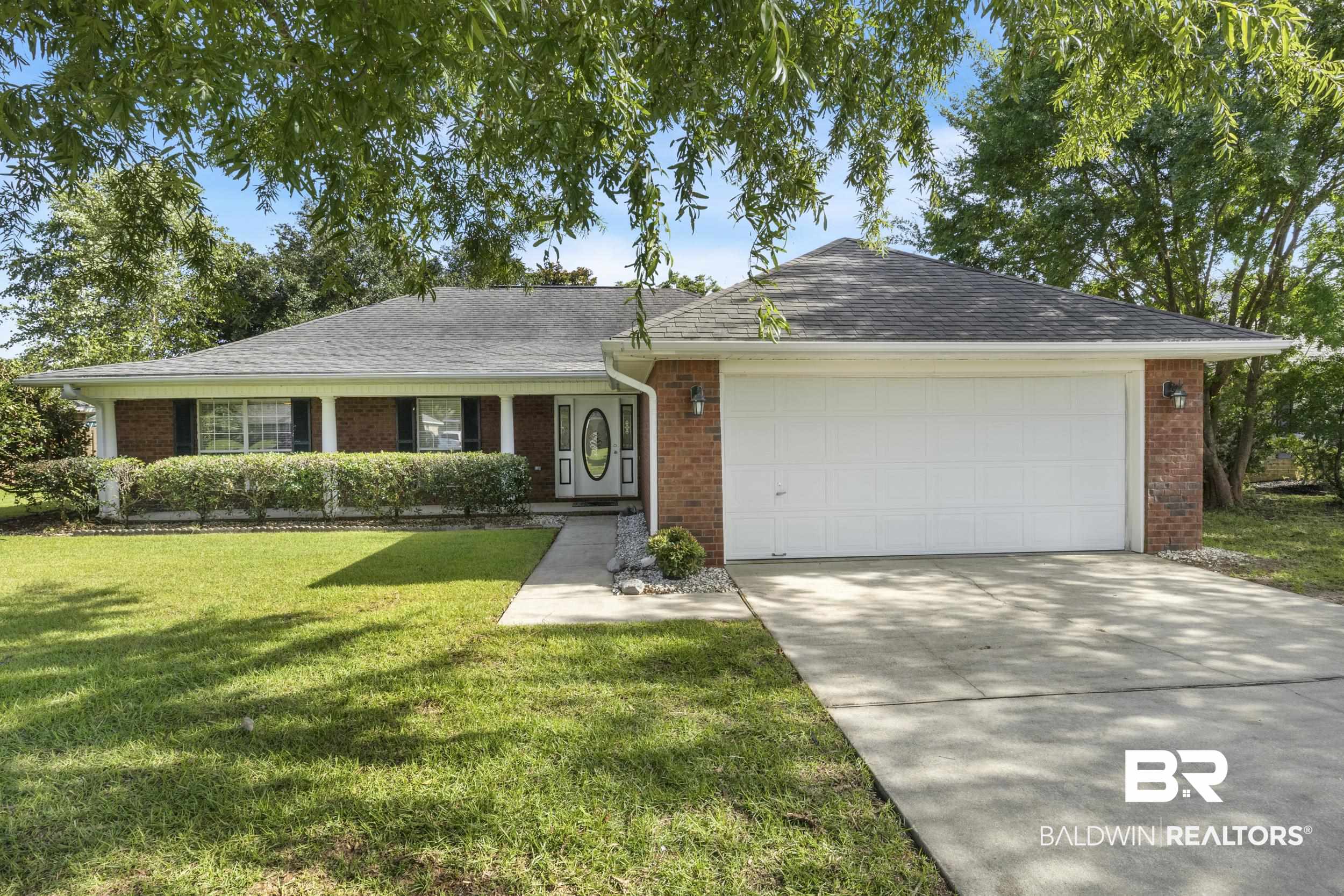 9610 Watkins Drive Fairhope, AL 36532 - Photo 1 of 26 Ranch-style home featuring a garage and a front yard