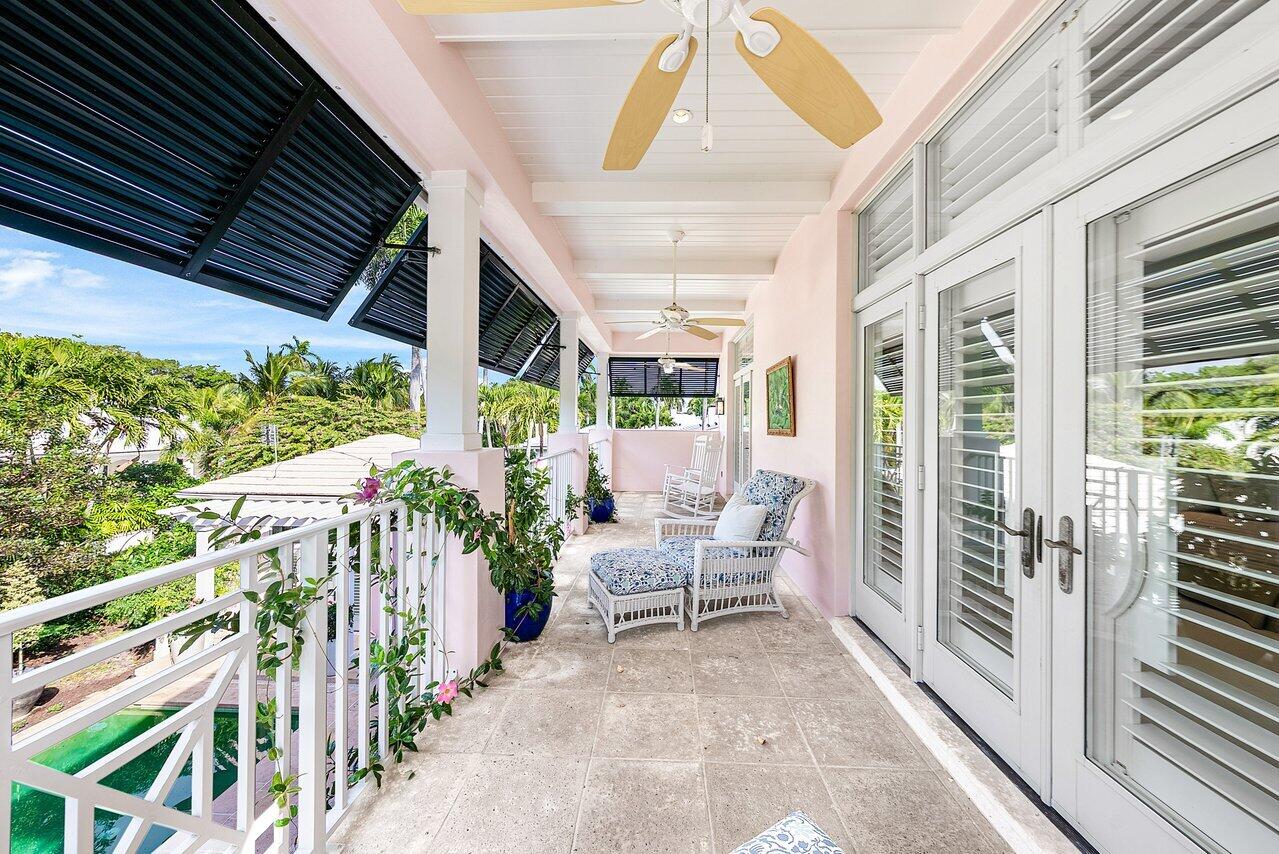 3138 Gulf Stream Road Gulf Stream, FL 33483 - Photo 17 of 49 a view of an chair and tables in the balcony
