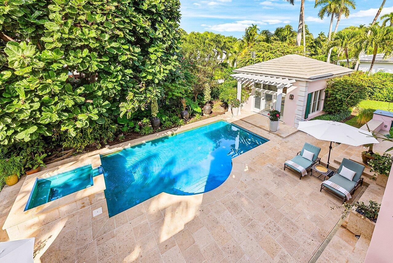 3138 Gulf Stream Road Gulf Stream, FL 33483 - Photo 18 of 49 a view of a swimming pool with a patio