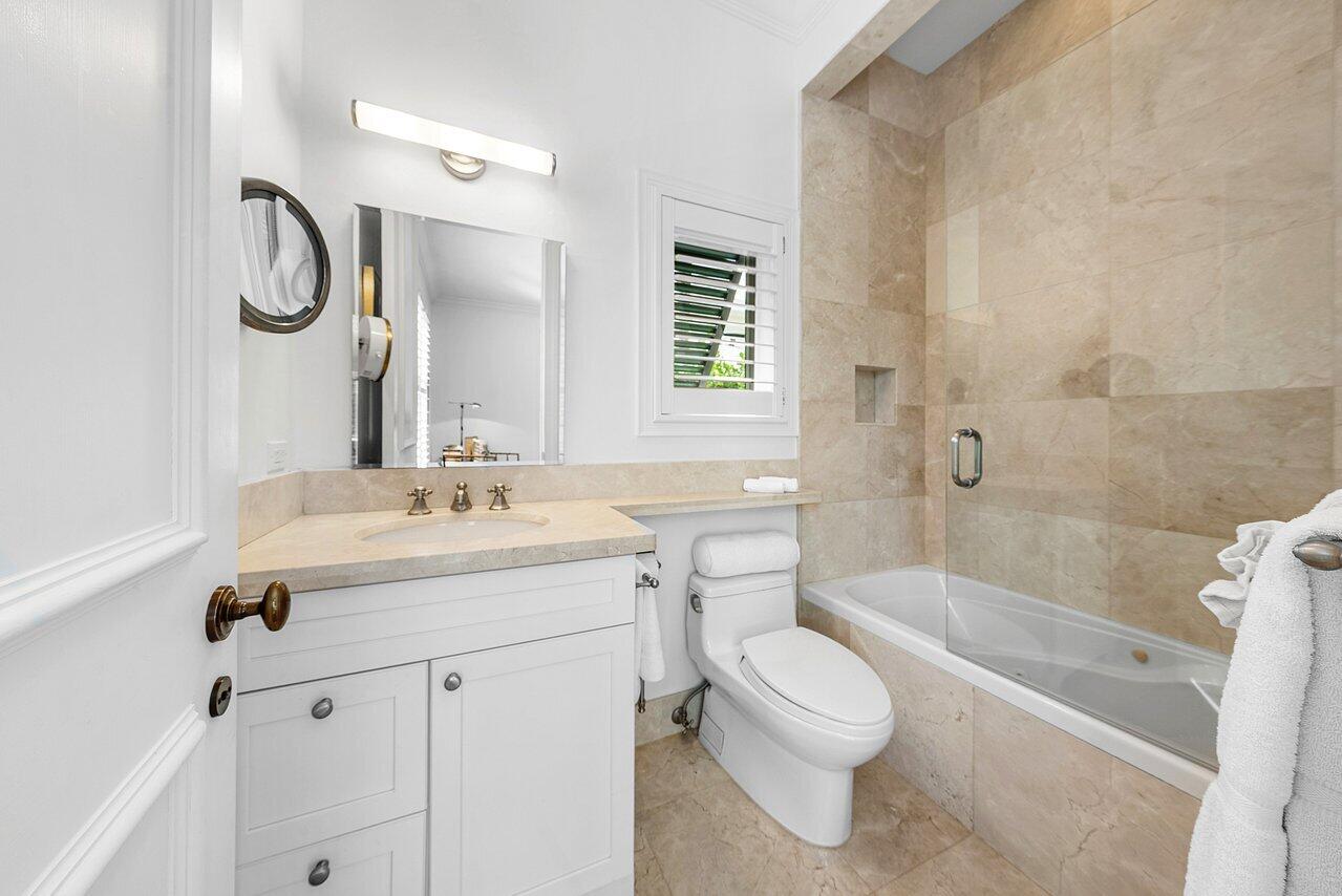 3138 Gulf Stream Road Gulf Stream, FL 33483 - Photo 27 of 49 a bathroom with a sink a toilet and a bathtub