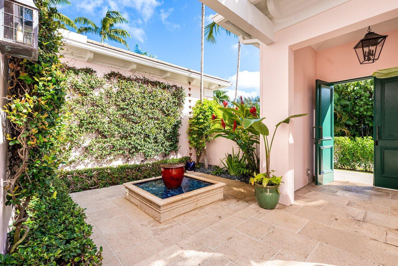 3138 Gulf Stream Road Gulf Stream, FL 33483 - Photo 4 of 49 a potted plant sitting on the side of a road