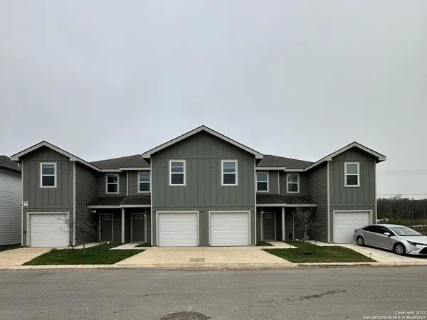 a front view of a house with a garage
