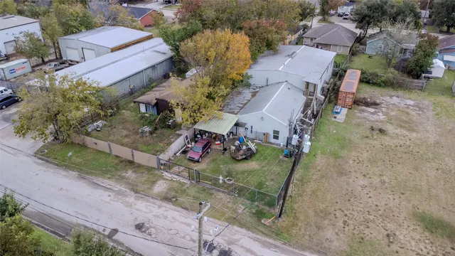 an aerial view of a house with outdoor space