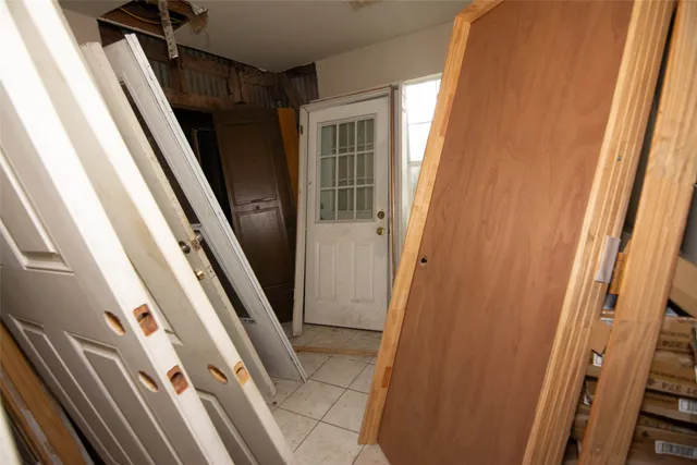 a bedroom with furniture and a window