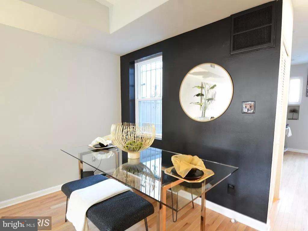 624 14th Place Northeast Washington, DC 20002 - Photo 5 of 22 a dining room with furniture and a mirror