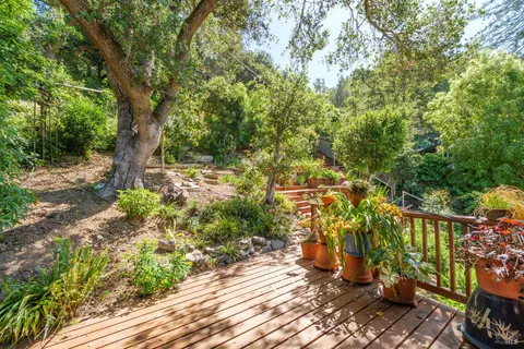 an aerial view of house with yard and outdoor seating