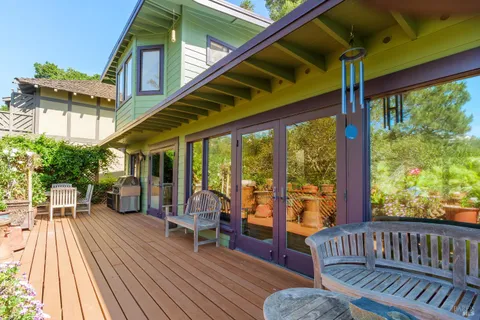 a view of living room with balcony and furniture