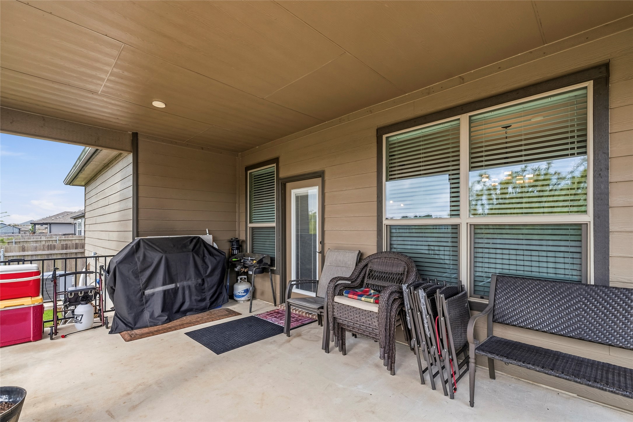 105 West Point Way Elgin, TX 78621 - Photo 17 of 27 Covered patio with a concrete slab, recessed lighting, and a railing system