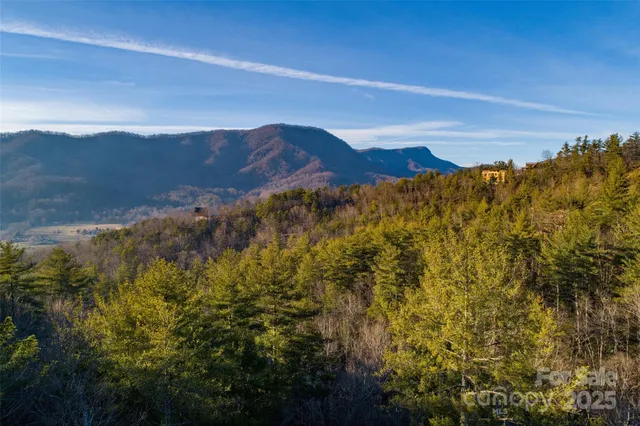 a view of a brick house next to a road