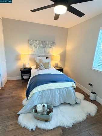 a bed room with a bed and a chandelier