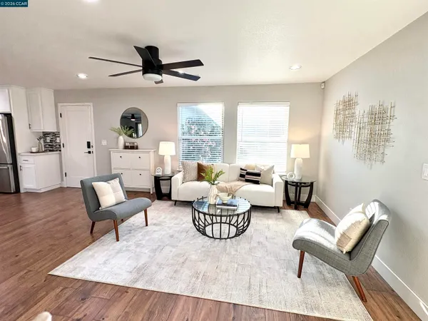 a living room with furniture and a large window