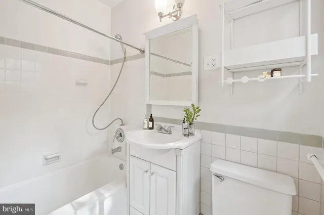 a bathroom with a sink a mirror and a shower