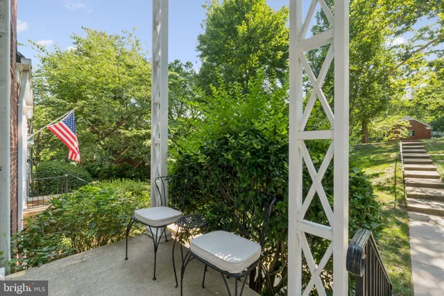 a view of a chair and table in backyard